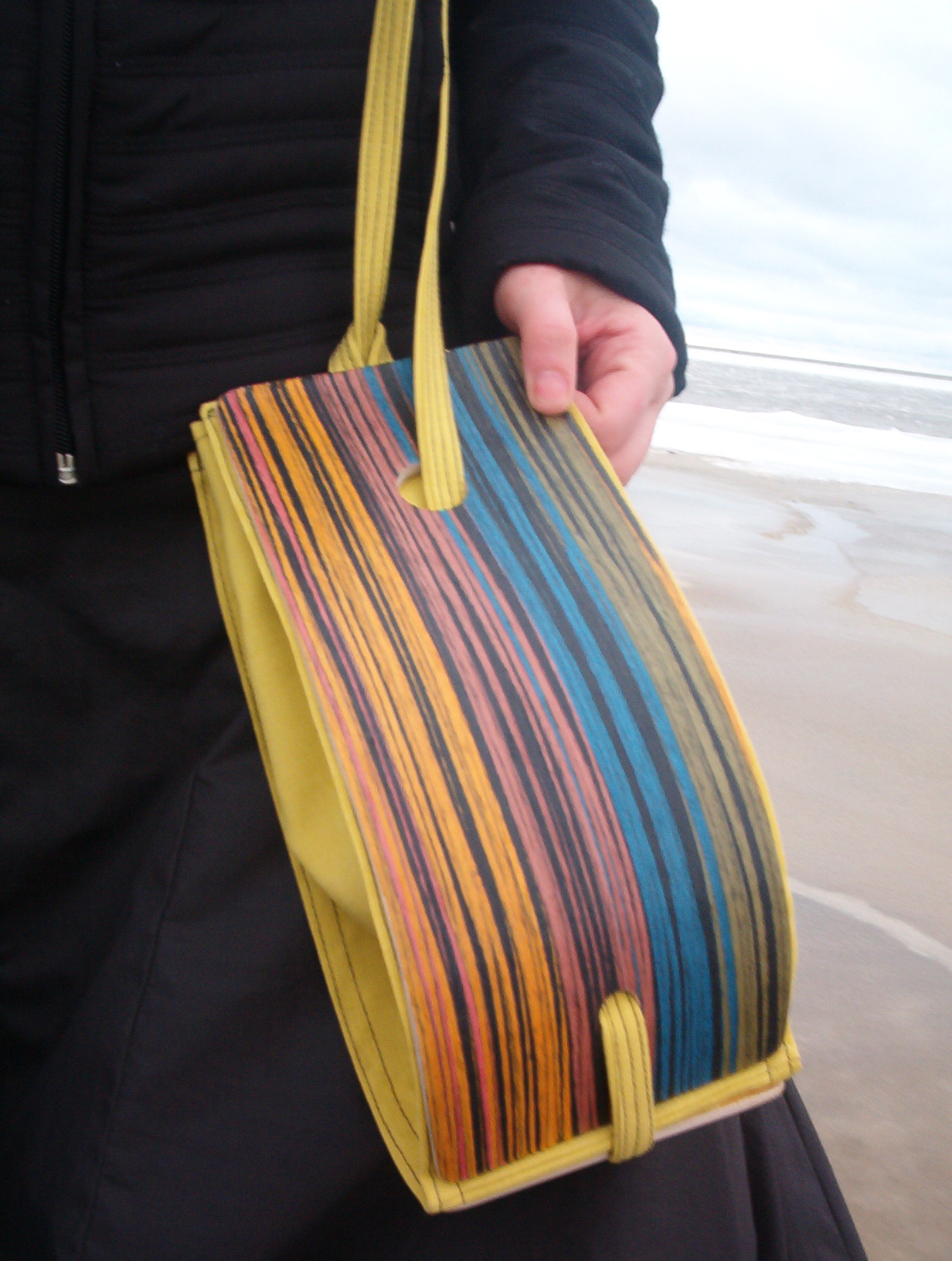 wooden intarsia bag with yellow fabric and colourful paint